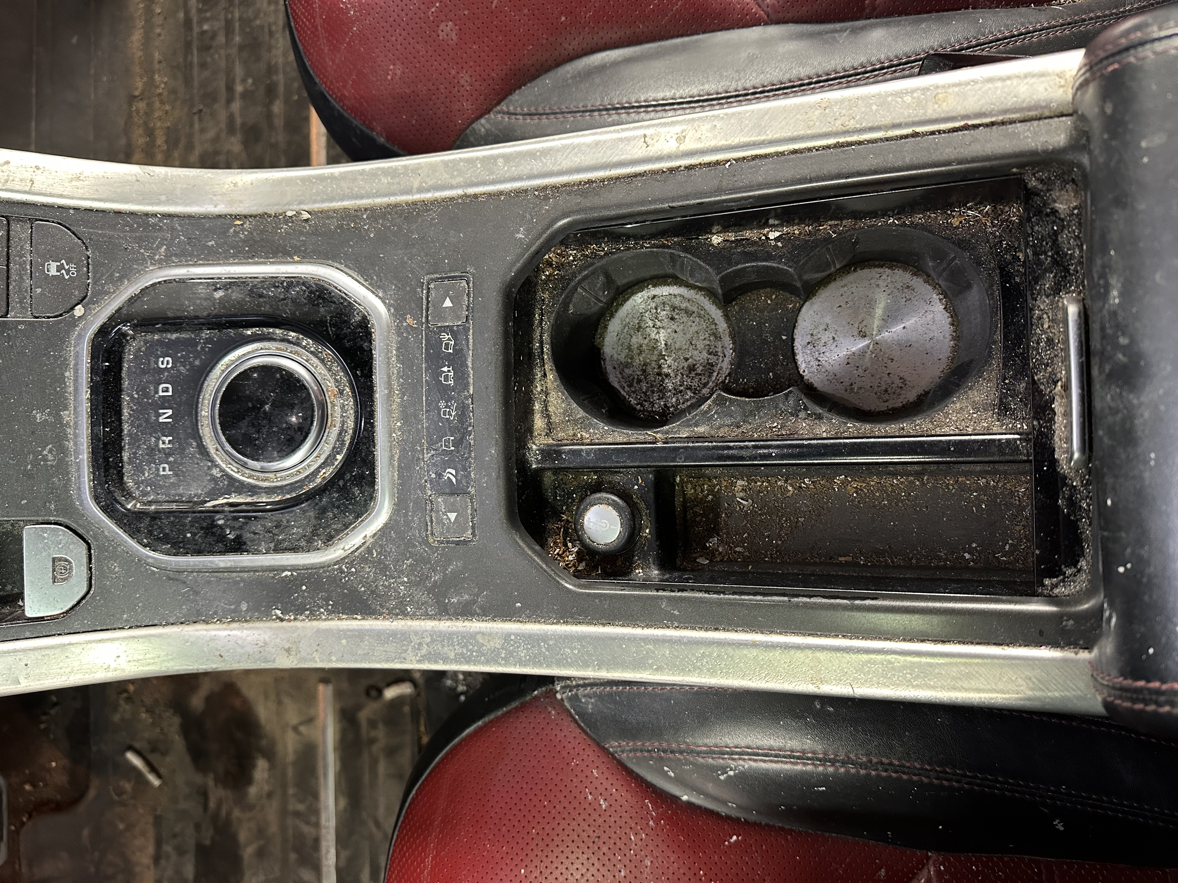 Range Rover console before cleaning — dirt and grime