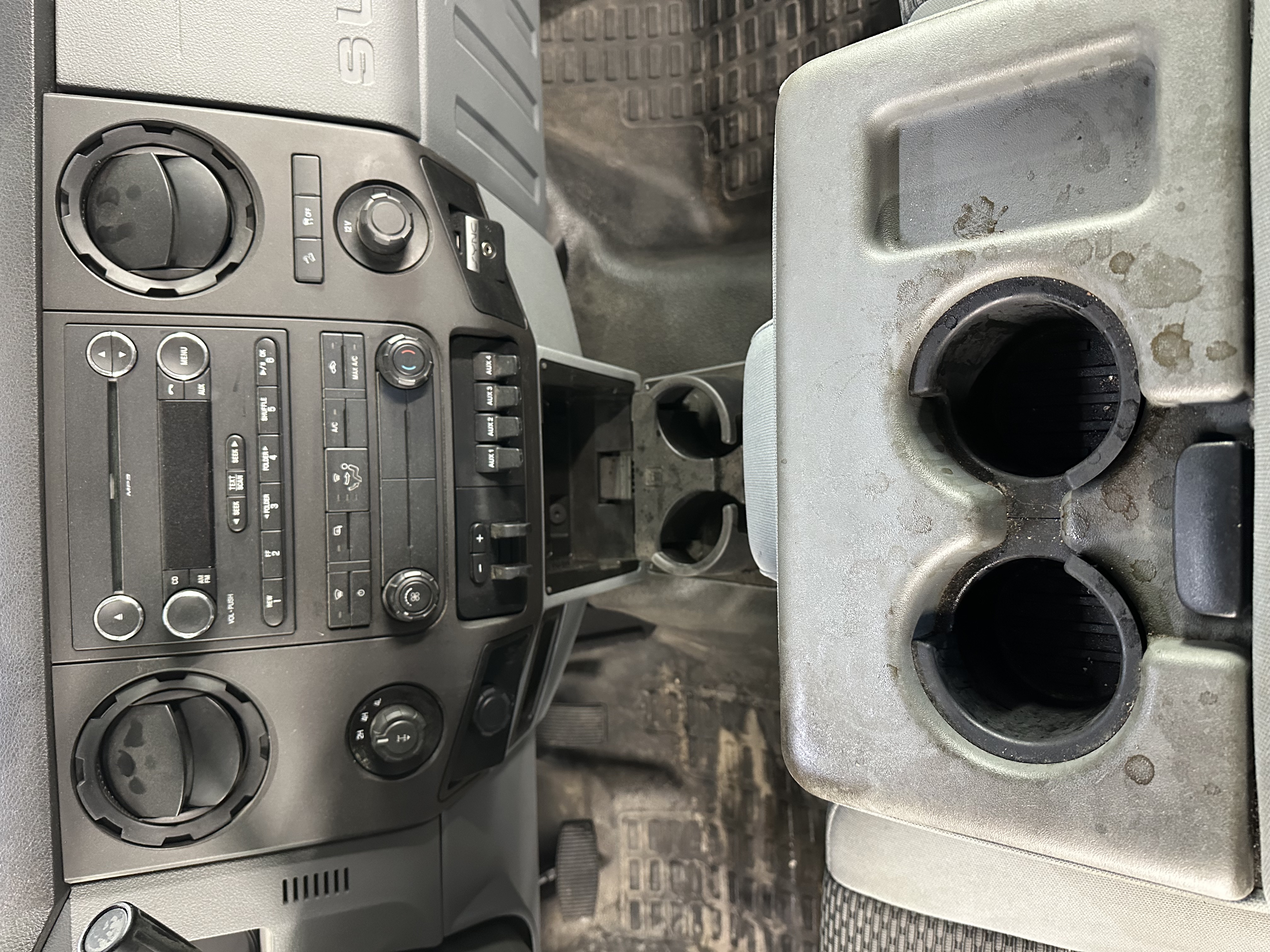 Truck dashboard before detailing — dusty and stained